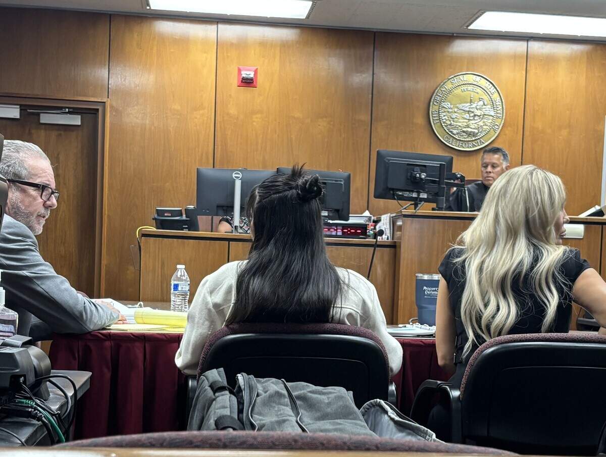 Cassie Michael, center, sits between her attorneys Jeff Hammerschmidt and Sally Vecchiarelli on Monday, Aug. 3, 2026, on the first day of trial for the alleged murder of Caleb Quick, a teen killed in Clovis over an alleged sexual assault.